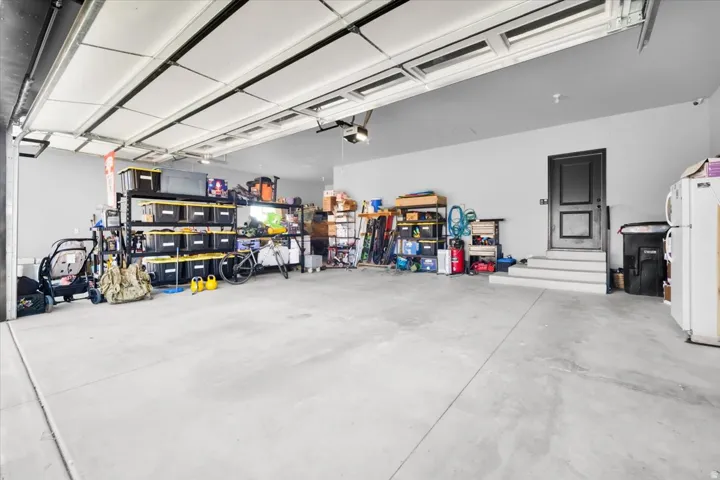 Garage with freestanding refrigerator