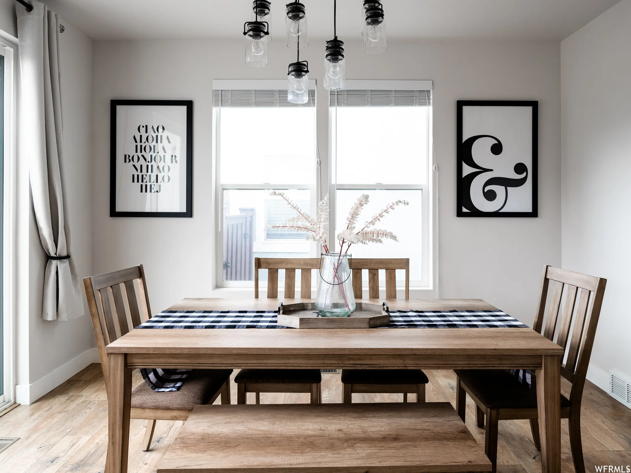 Dining space with light wood finished floors and baseboards