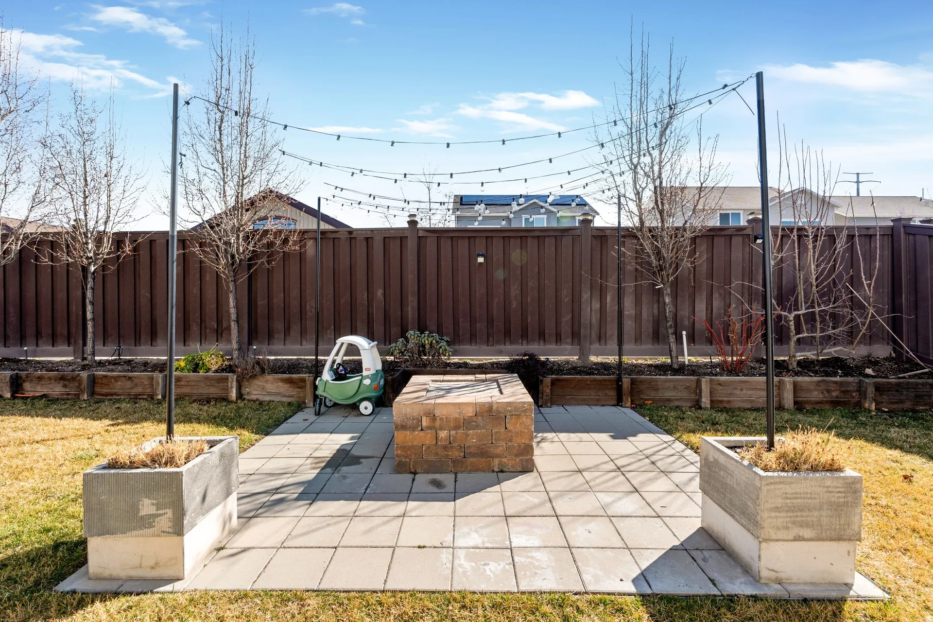 Fenced backyard with a patio