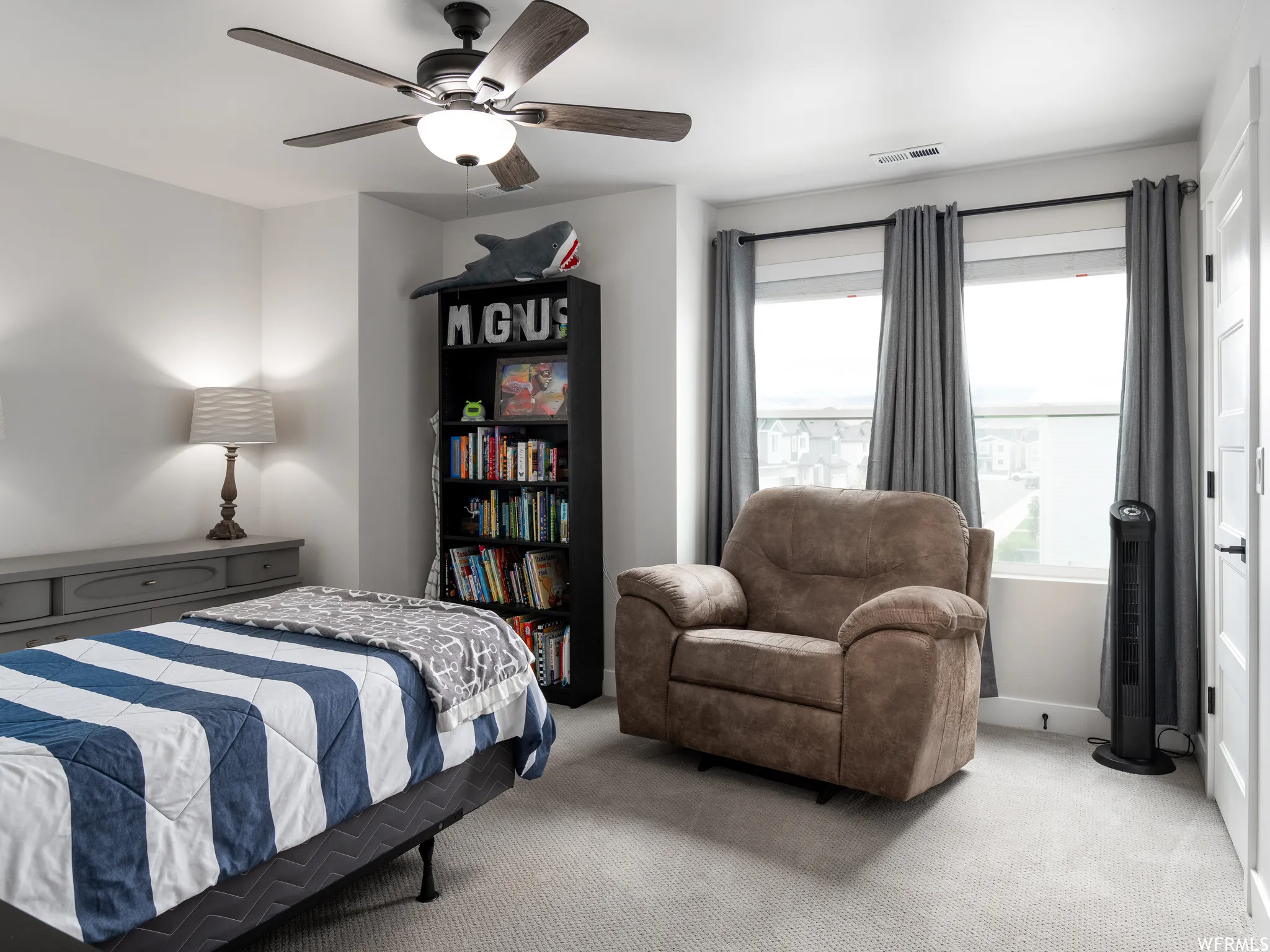 Bedroom with carpet flooring and ceiling fan