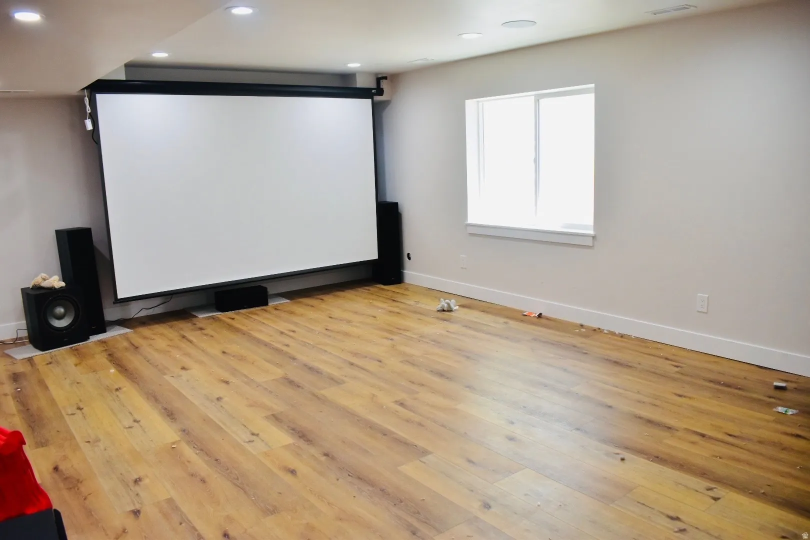 Home theater room featuring light wood finished floors and recessed lighting
