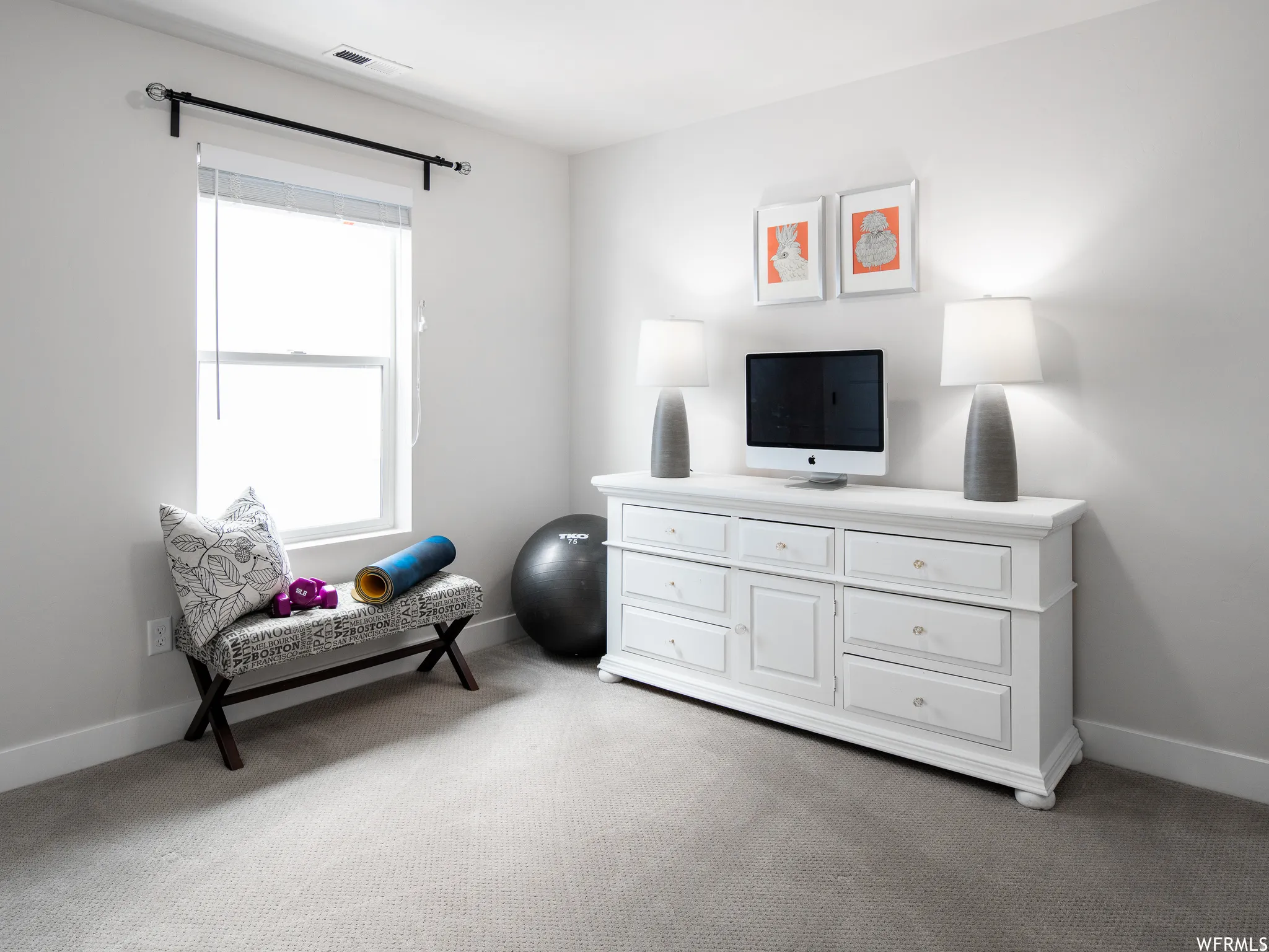 Sitting room with baseboards and light carpet
