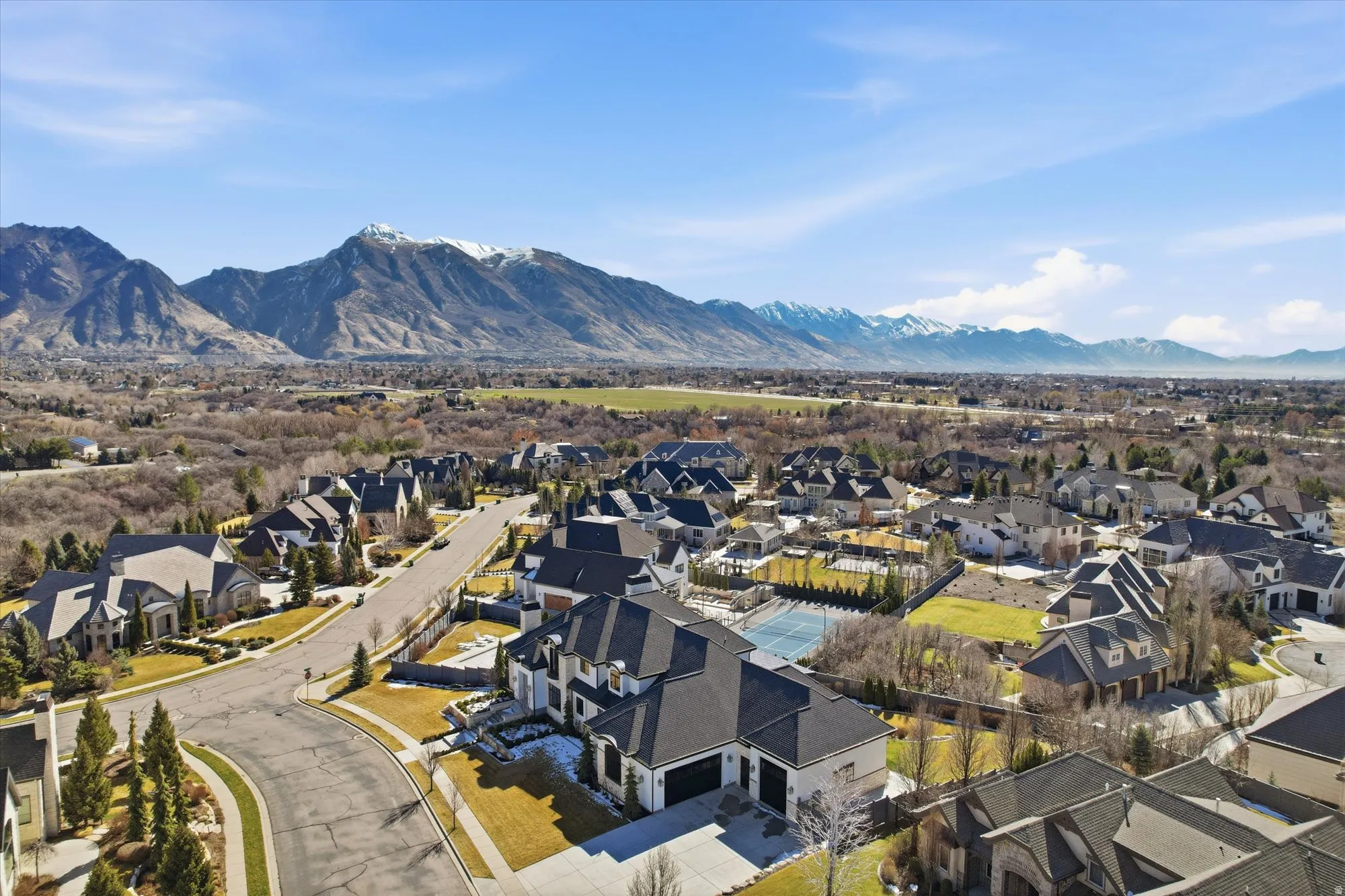 Aerial view of residential area featuring a mountain backdrop