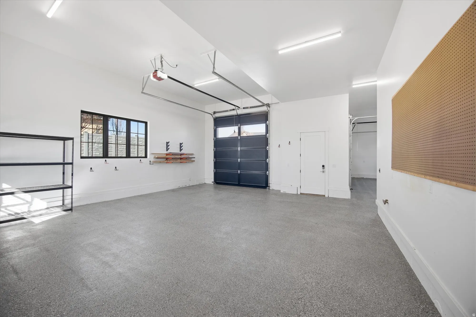 Garage featuring baseboards