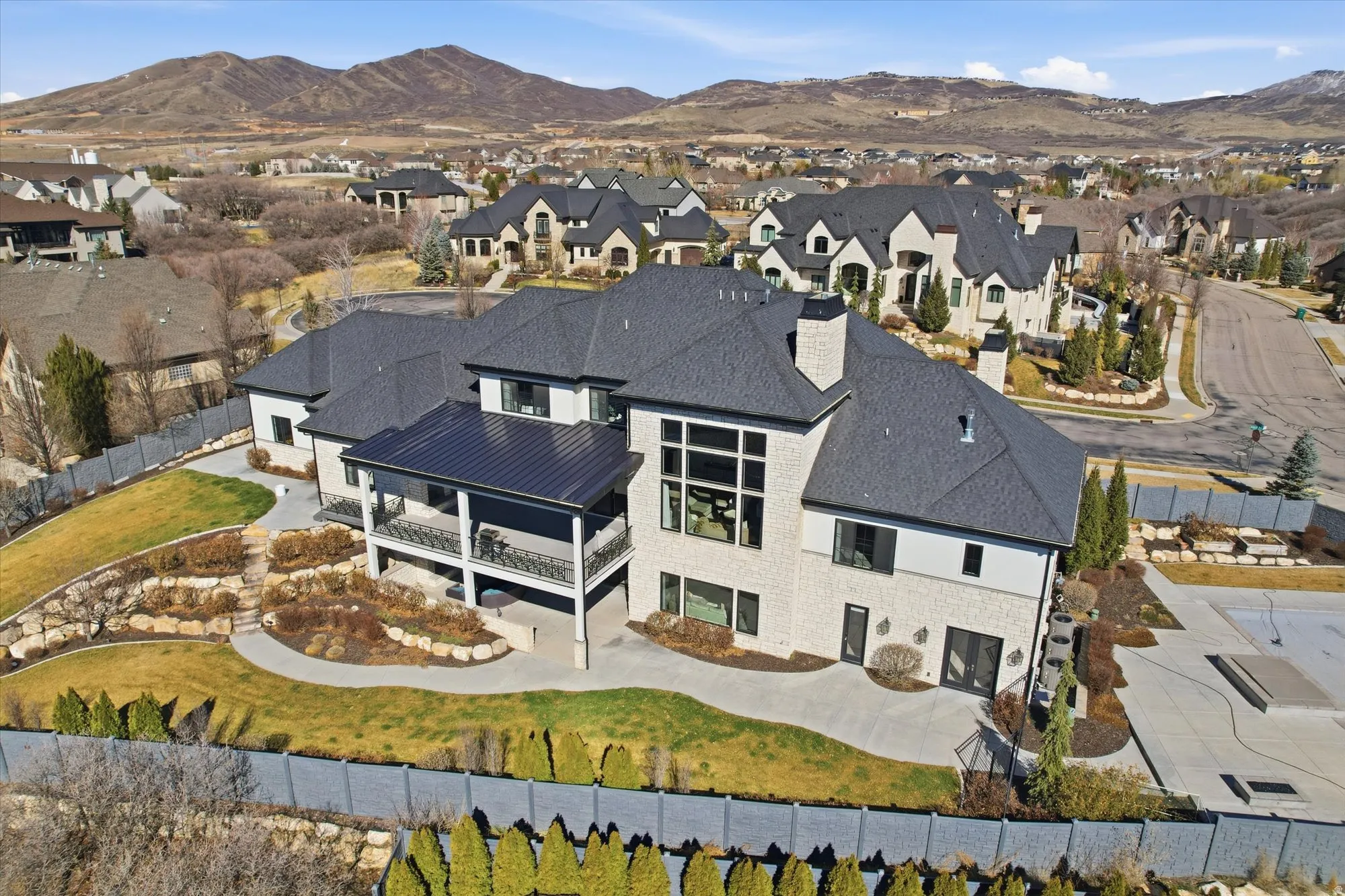 Aerial perspective of suburban area featuring a mountain backdrop