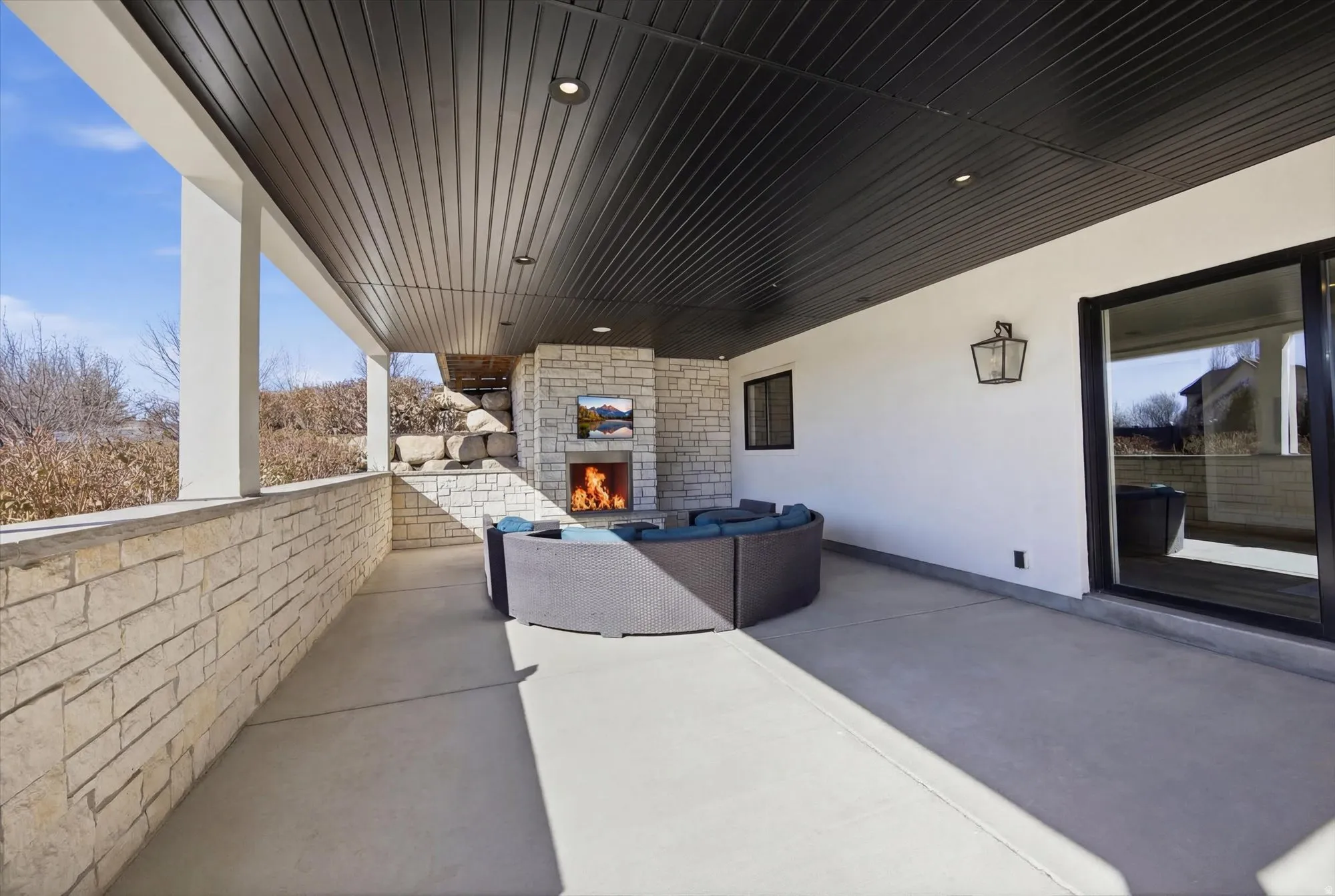 View of patio / terrace featuring an outdoor living space with a fireplace