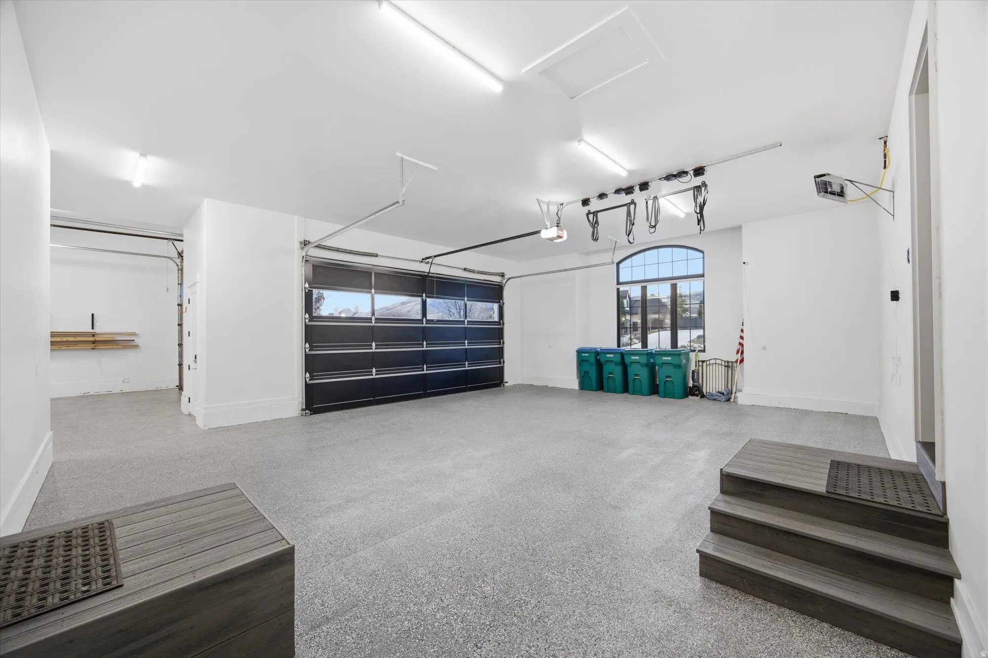 Garage featuring baseboards
