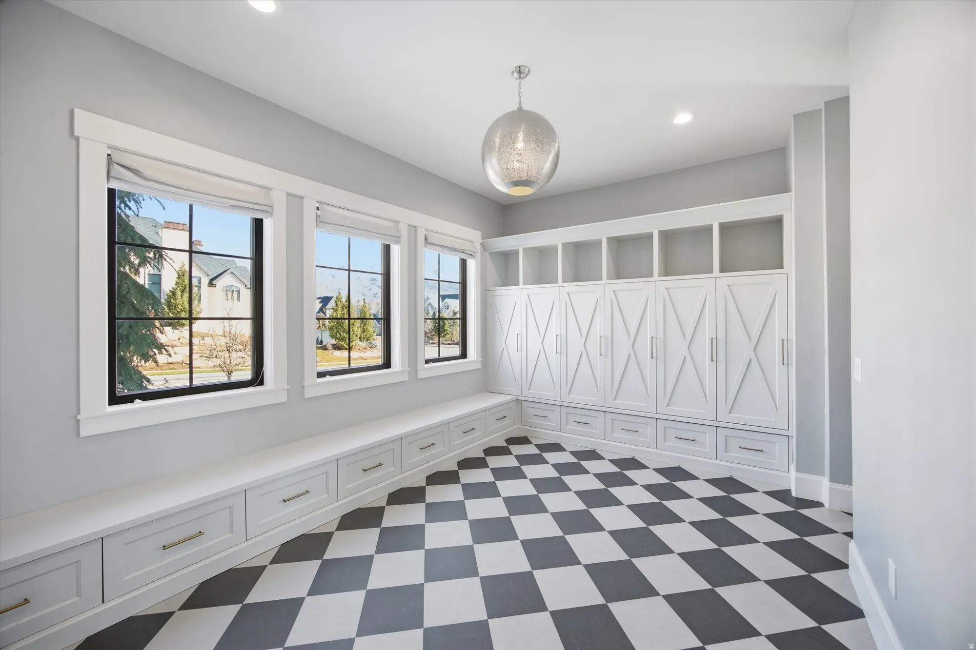 Mudroom featuring dark floors and recessed lighting