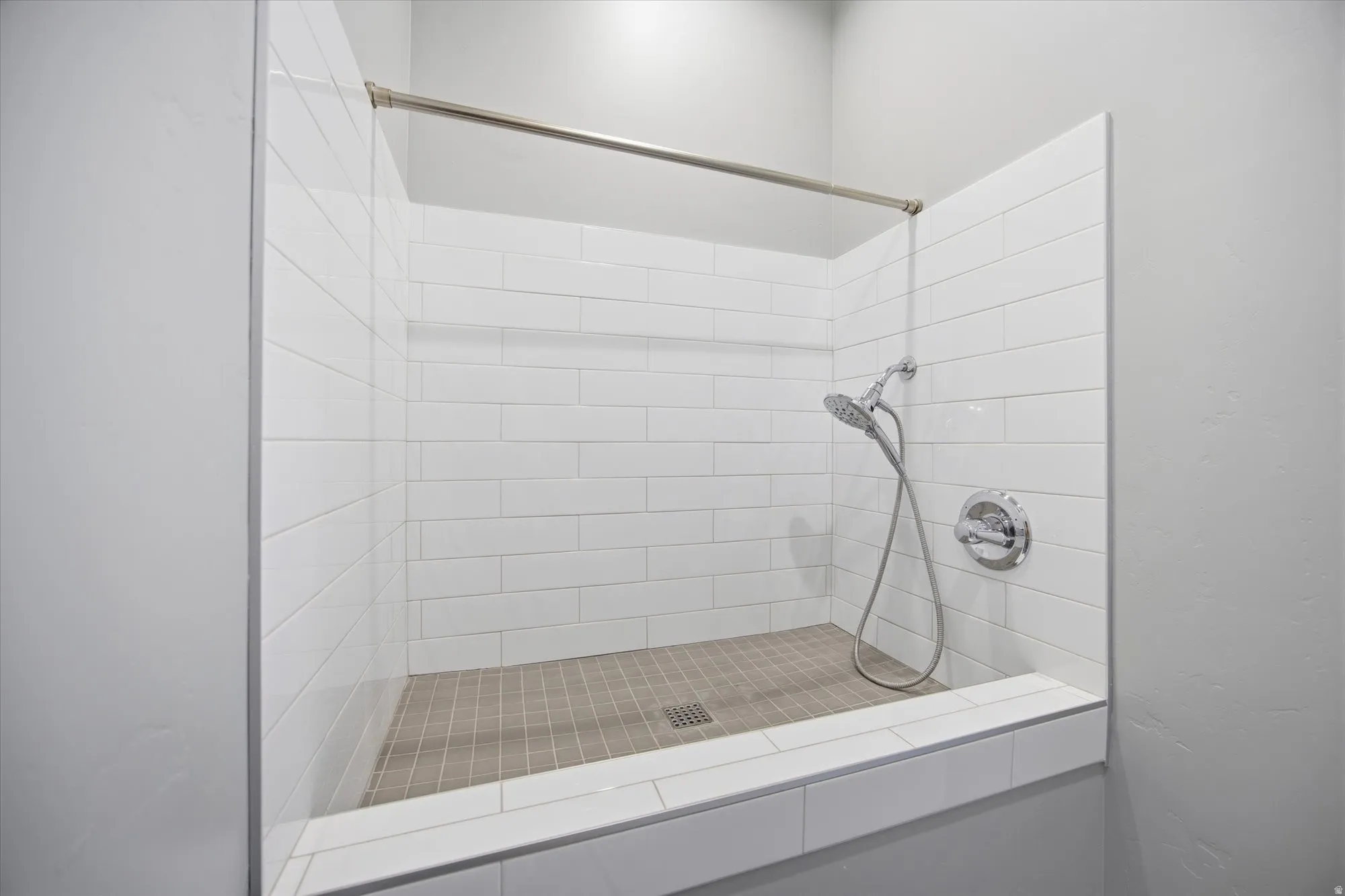 Full bath featuring a stall shower