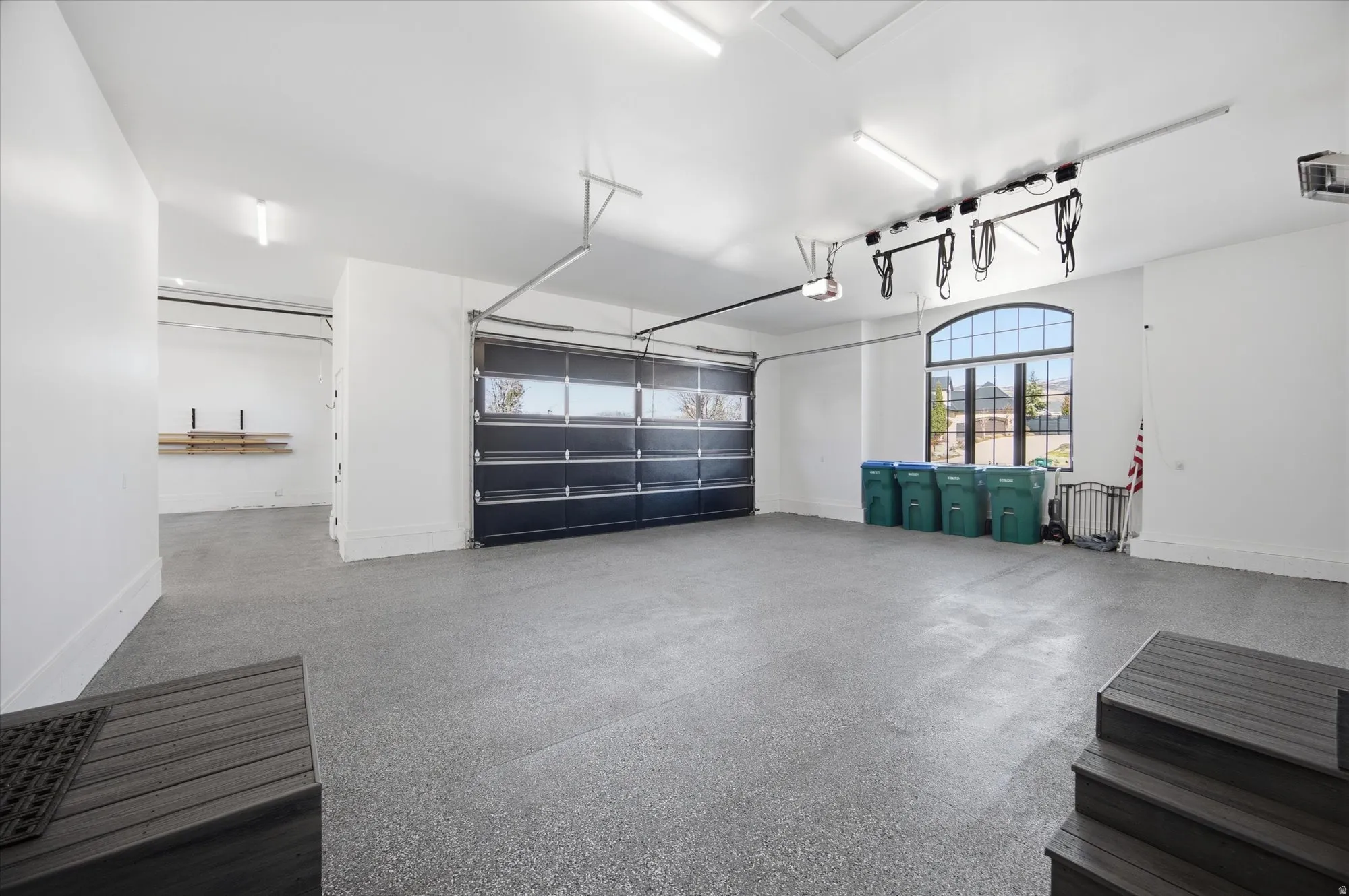 Garage featuring baseboards