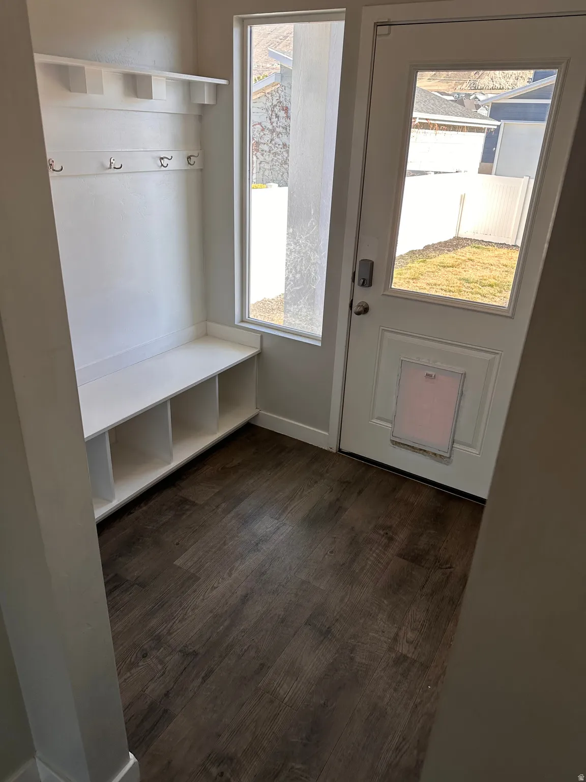 Mudroom with baseboards and dark wood-style flooring