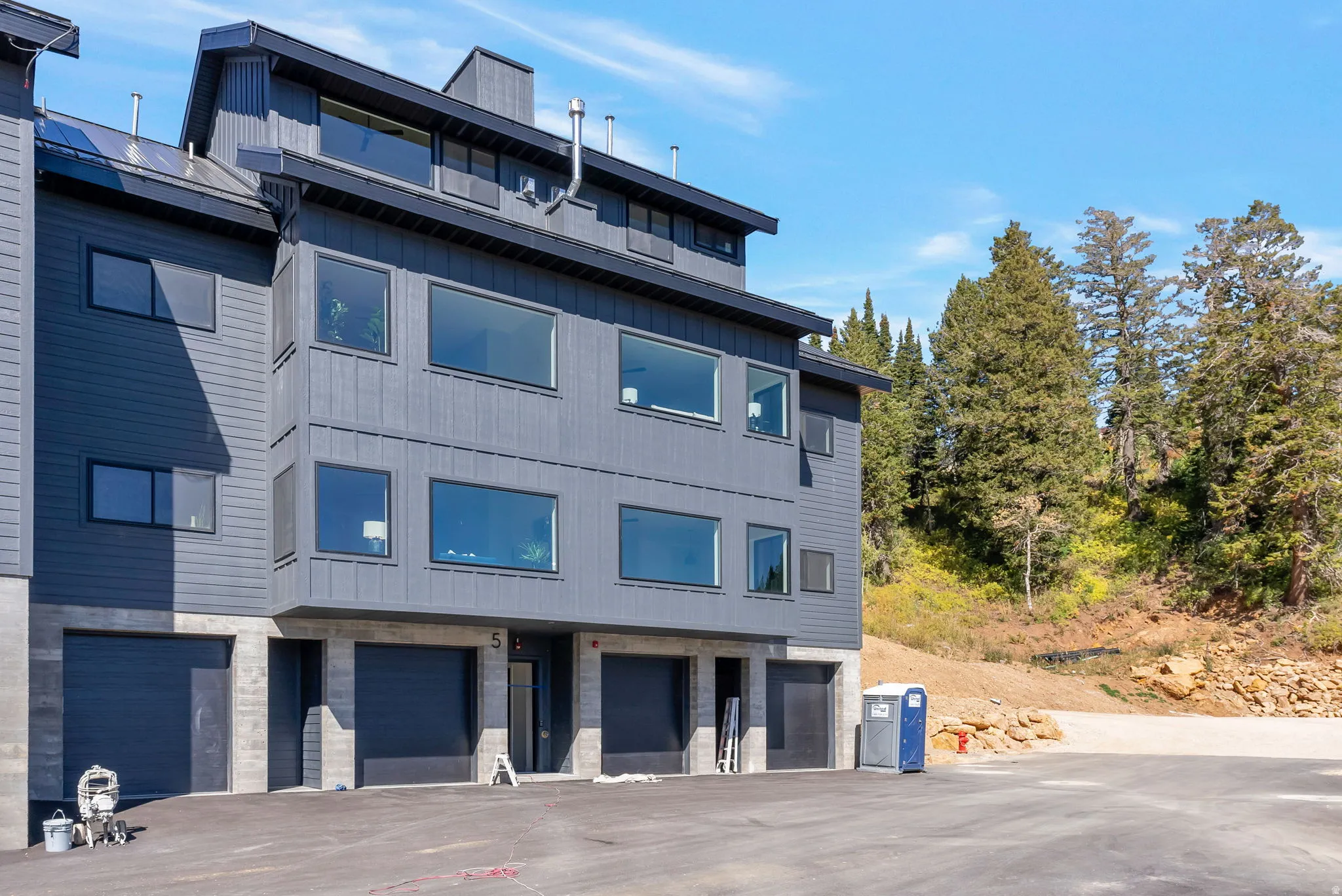 View of apartment building / complex with a garage