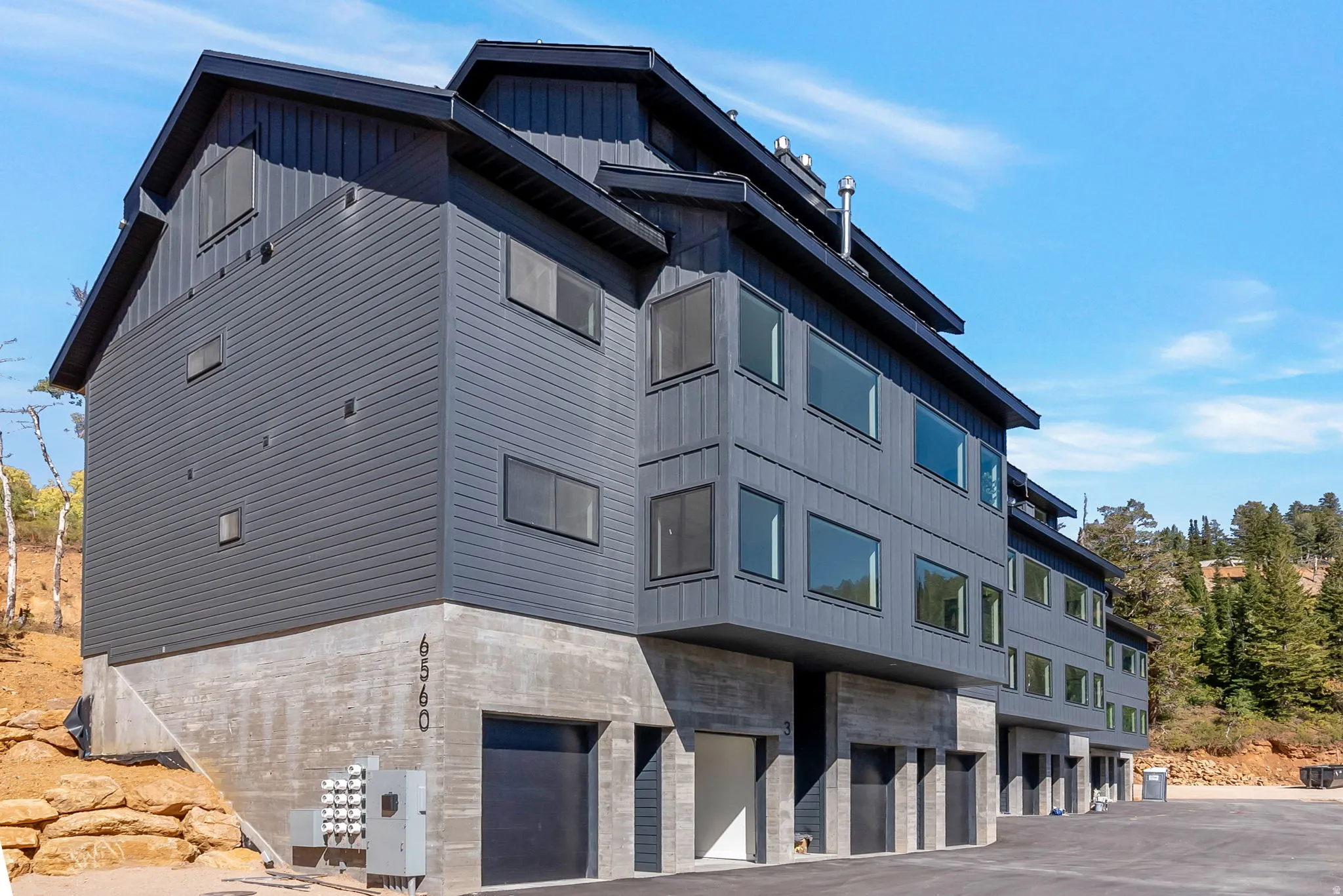 View of apartment building / complex with a garage