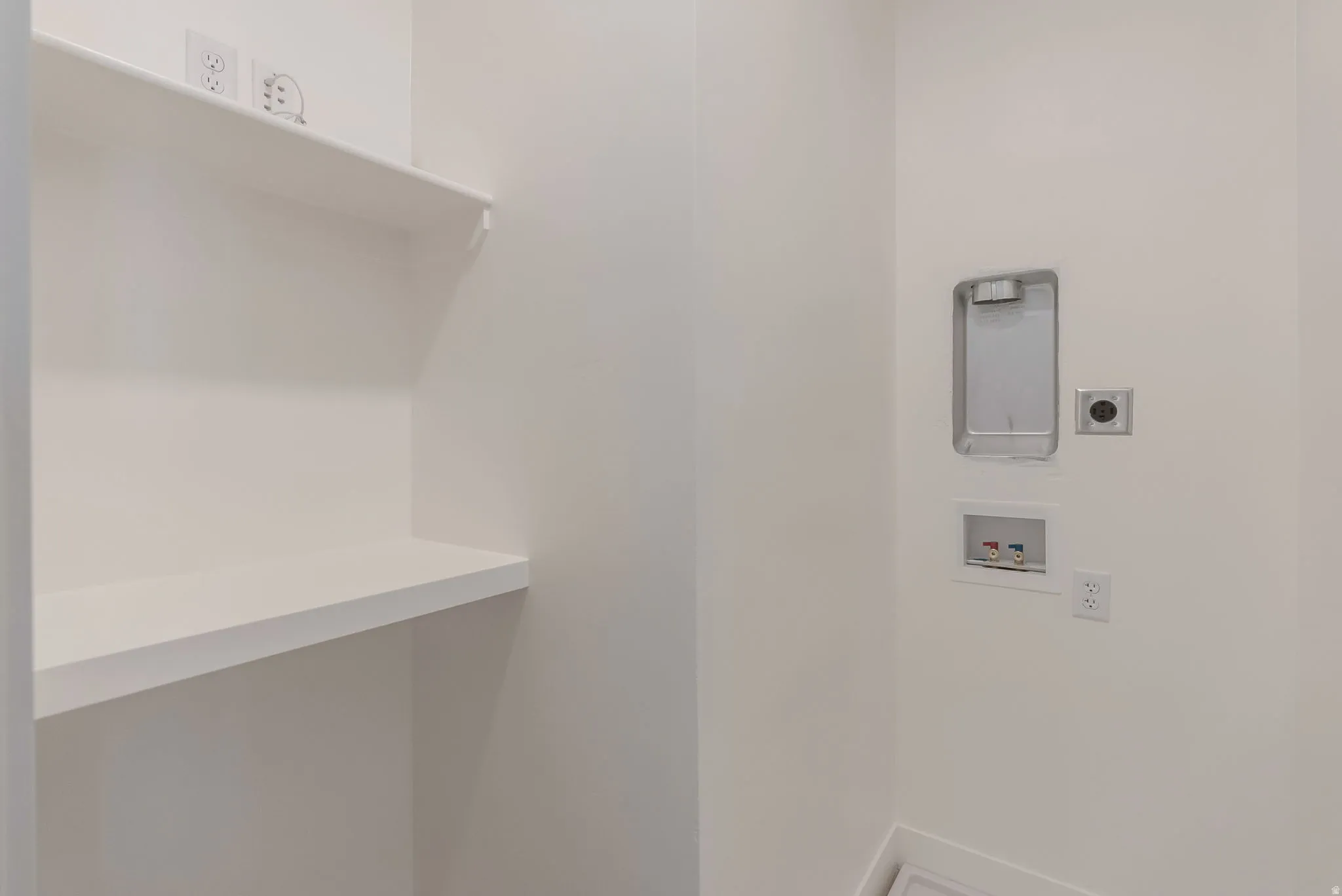 Laundry room featuring washer hookup and electric dryer hookup
