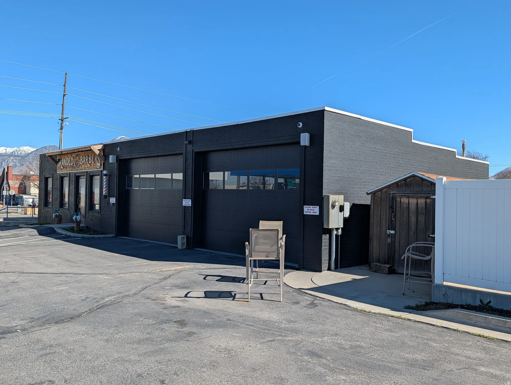 View of building exterior featuring a garage