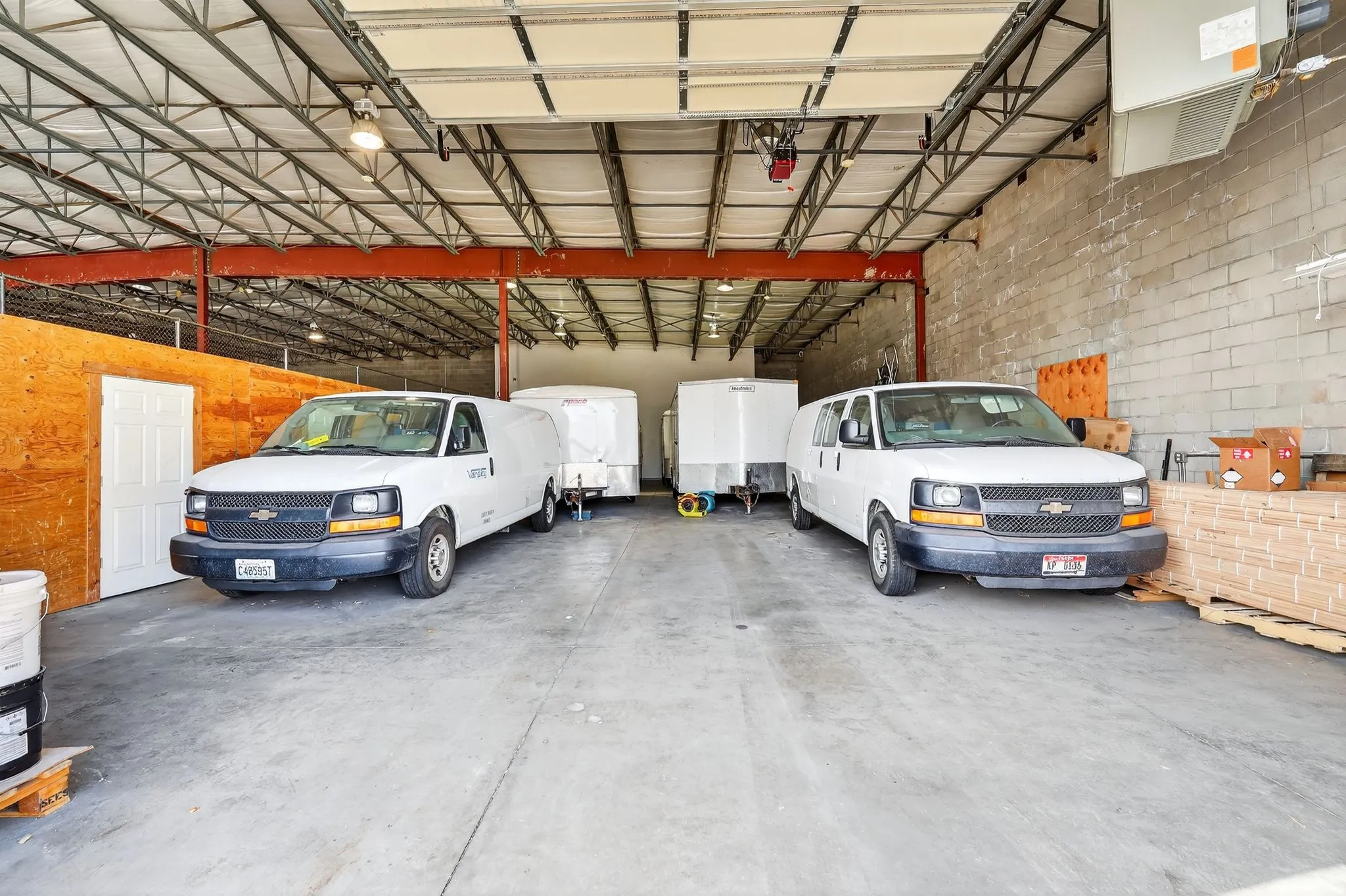 Garage featuring a heating unit