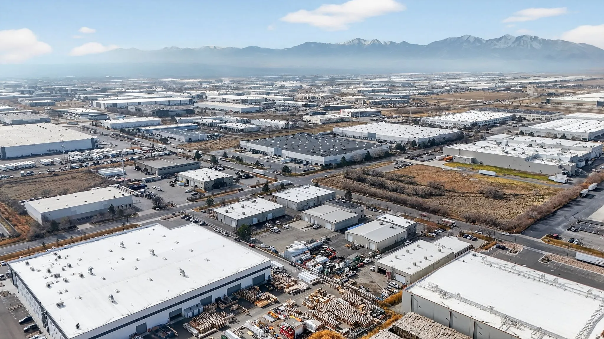 Drone / aerial view of industrial structures and mountains