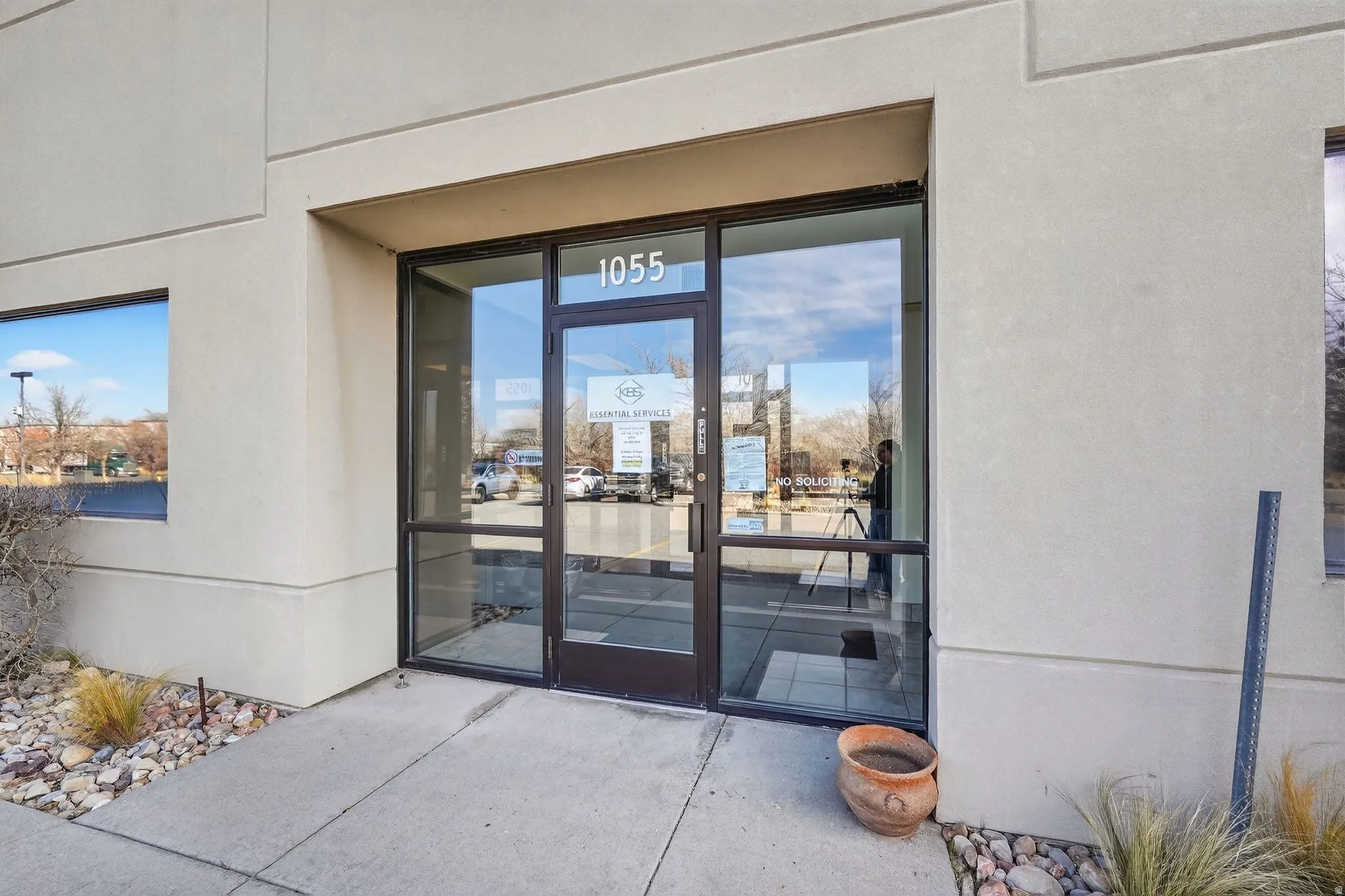 Entrance to property featuring stucco siding
