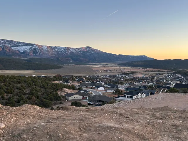 View of mountain backdrop with nearby suburban area