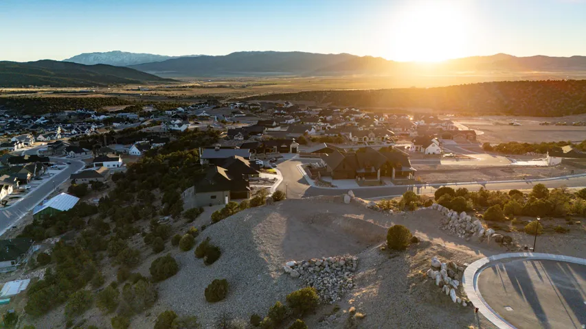 Aerial view of residential area featuring a mountainous background
