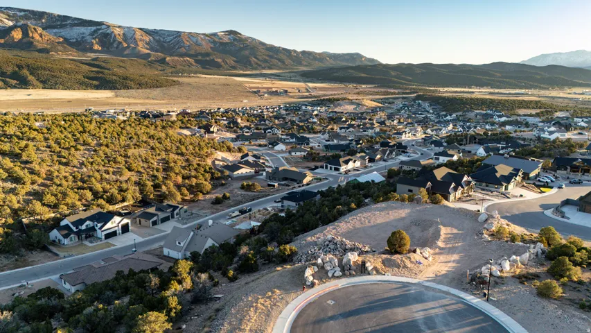 View of property location featuring a mountainous background and nearby suburban area