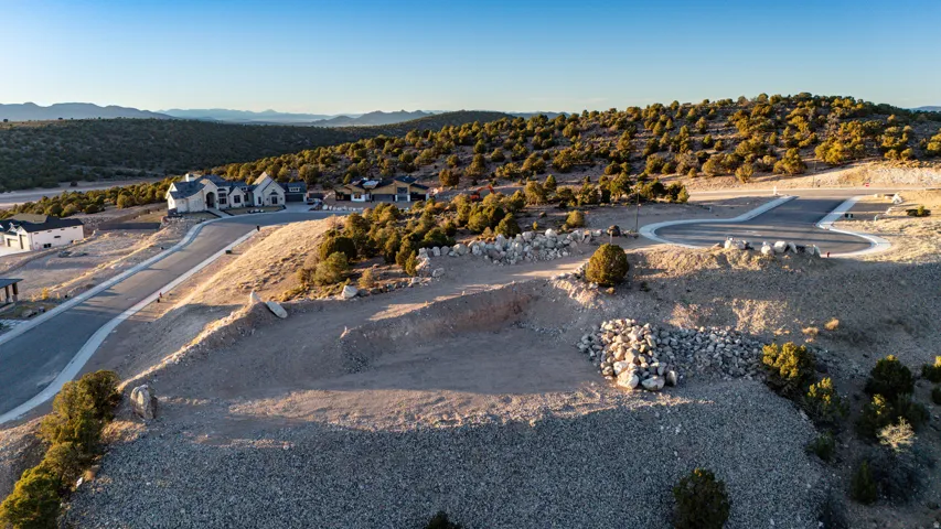 Aerial perspective of suburban area with a mountain backdrop