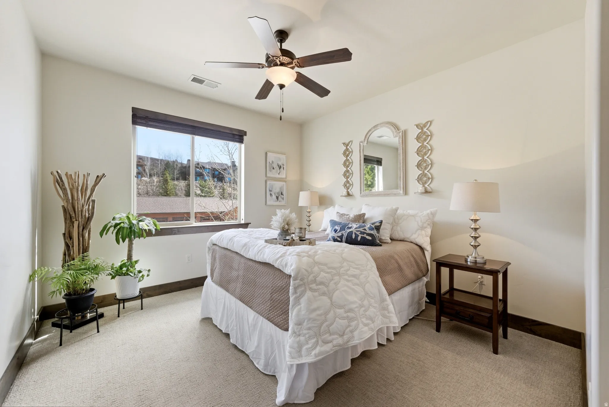 Bedroom featuring carpet and a ceiling fan