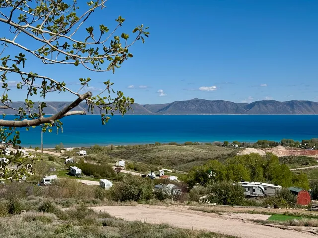 Elevated property with clear sightlines to a large body of water and distant mountains