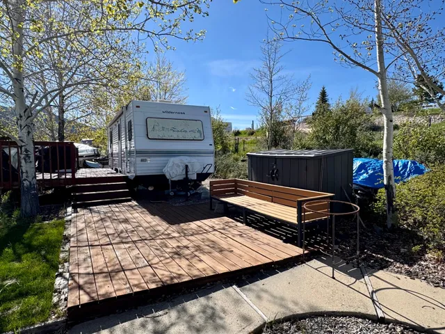 Expansive multi-level wood decking with integrated steps