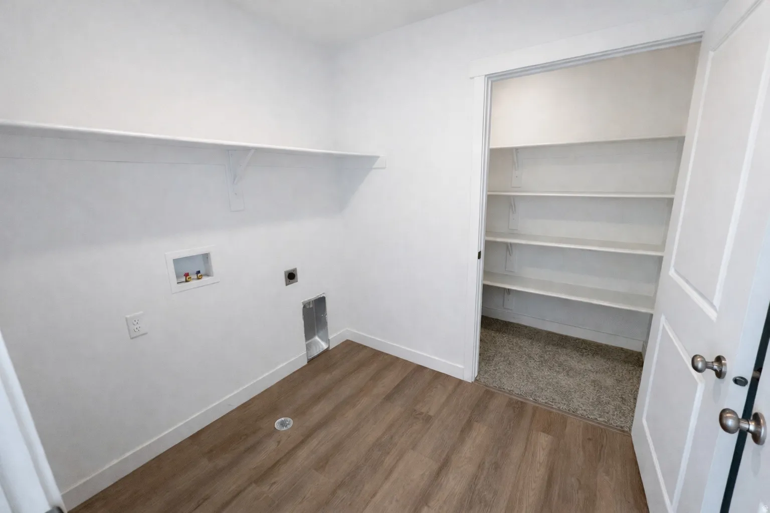 Laundry area featuring dark wood-style flooring, hookup for an electric dryer, and washer hookup