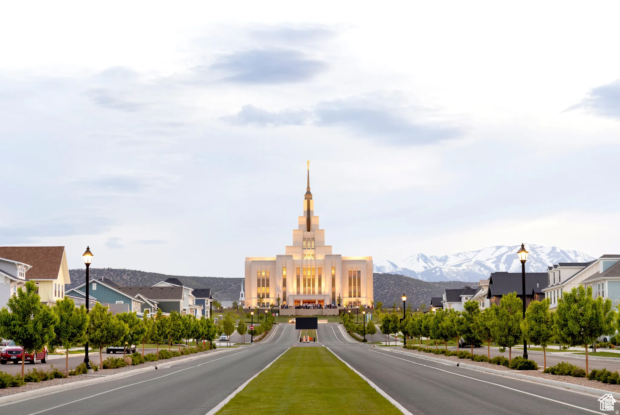 View of asphalt road with street lighting, a mountain view, and a residential view