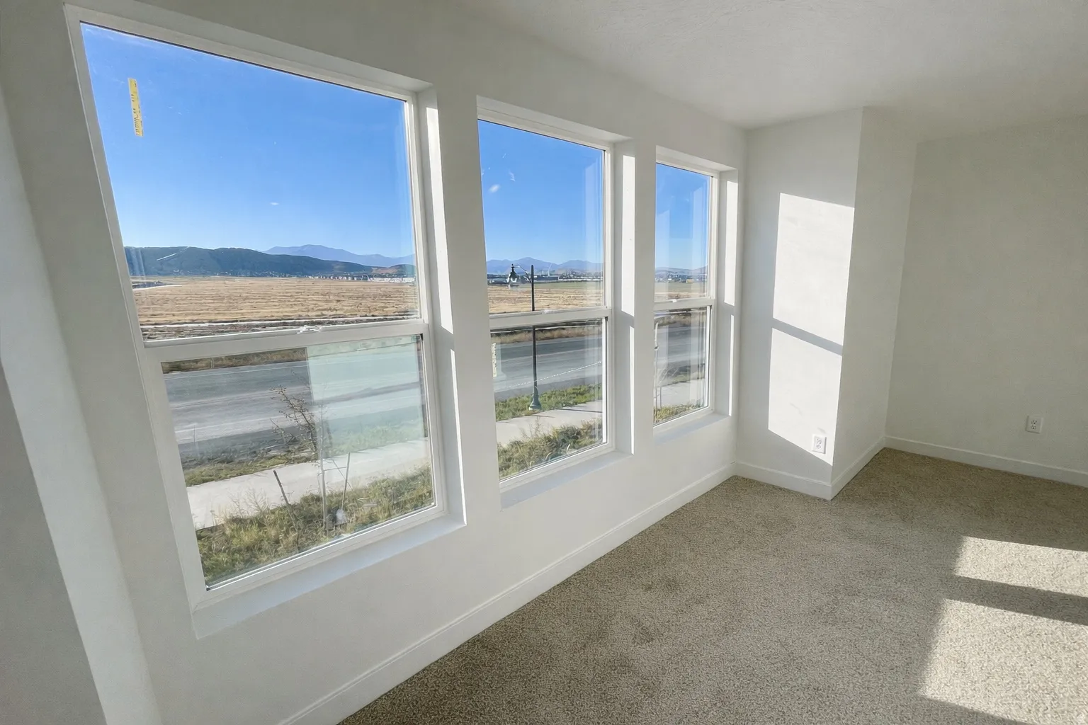 Unfurnished sunroom featuring a mountain view