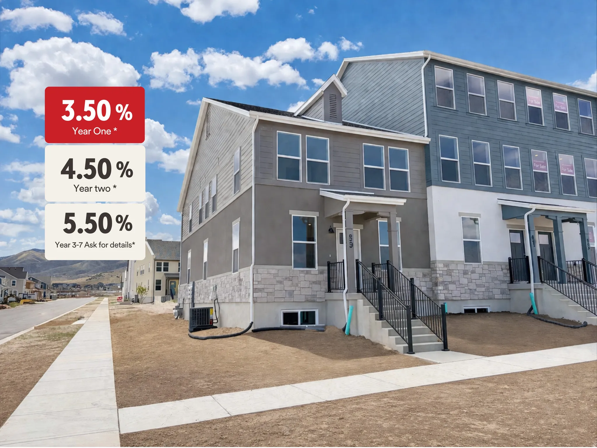View of front facade with stone siding, stucco siding, and a mountain view