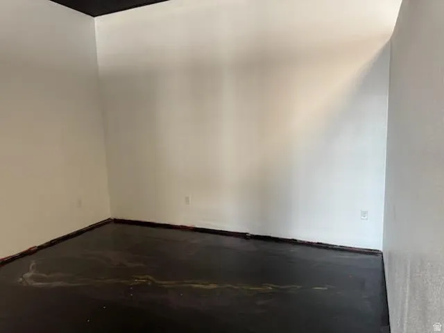 Spare room featuring concrete floors
