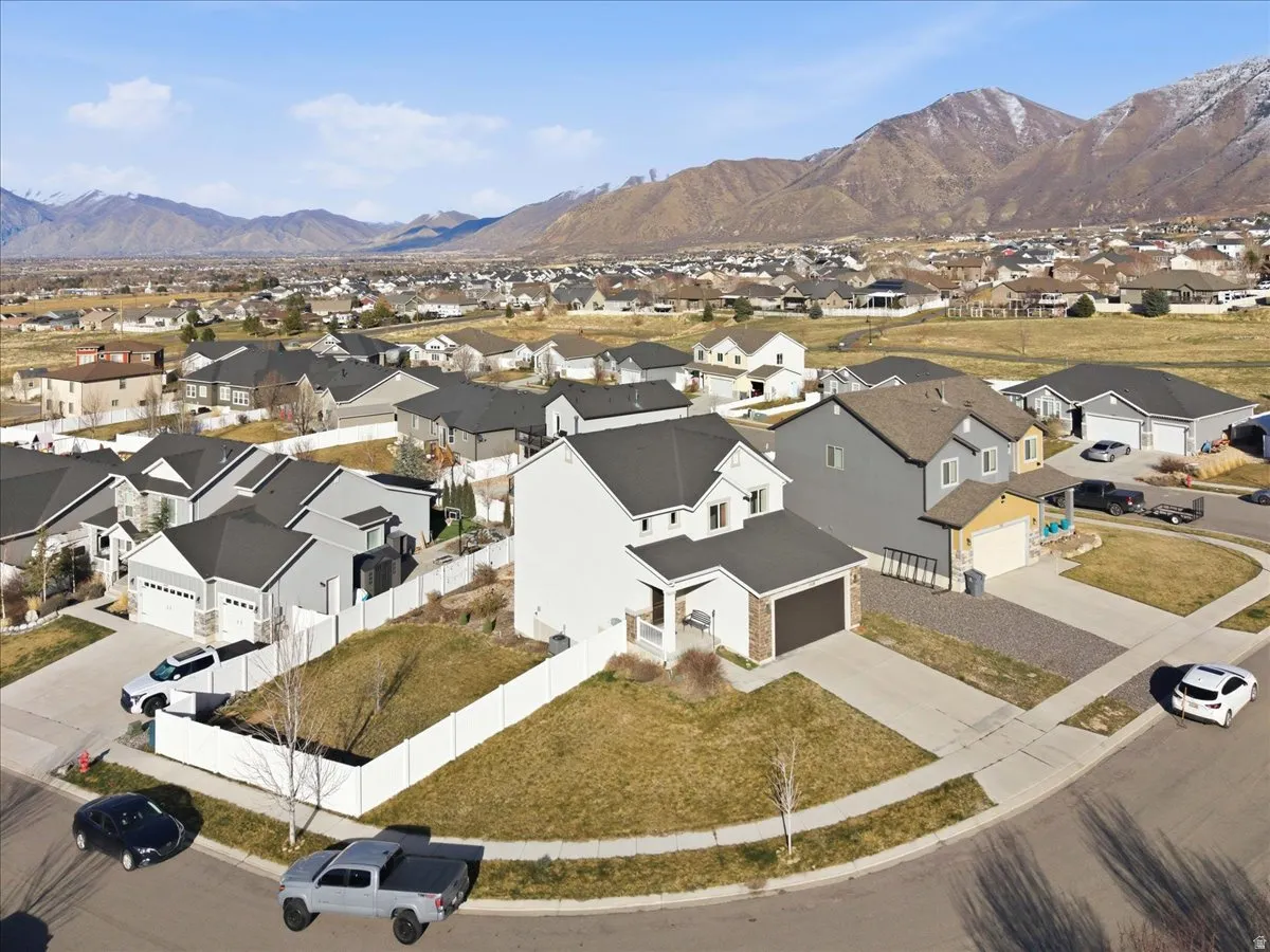 Aerial perspective of suburban area with a mountainous background