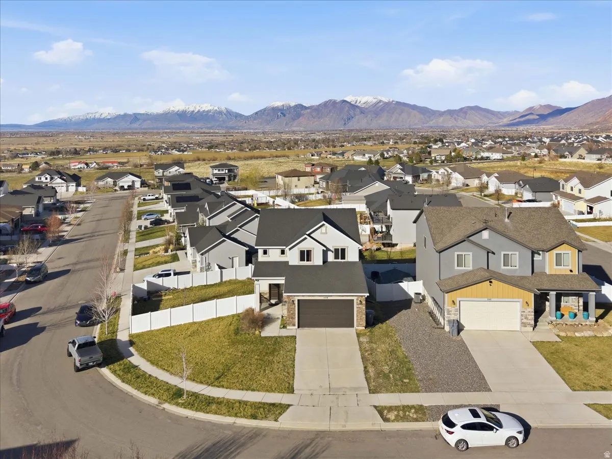 Aerial perspective of suburban area featuring a mountainous background