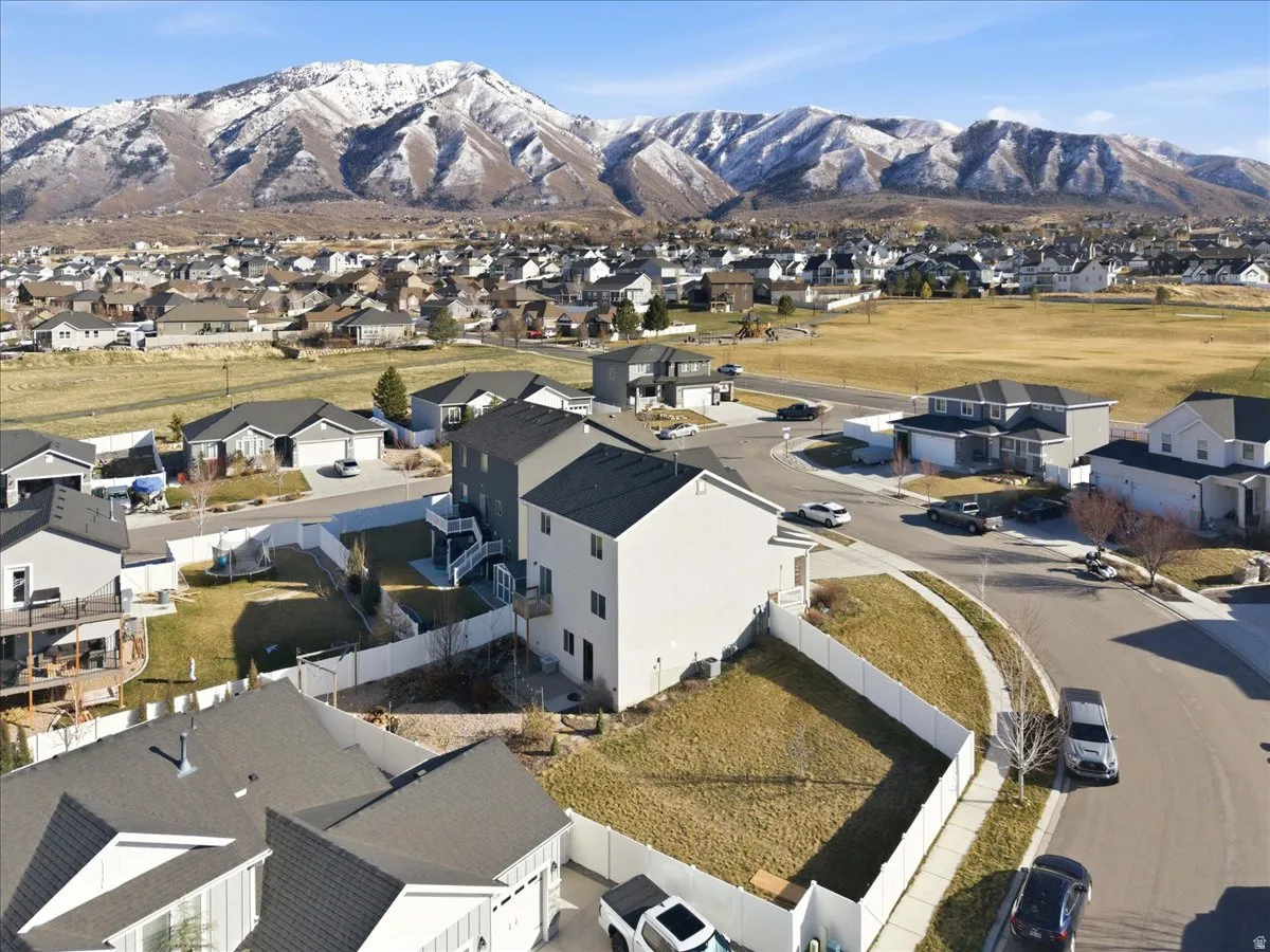 Aerial view of residential area featuring mountains