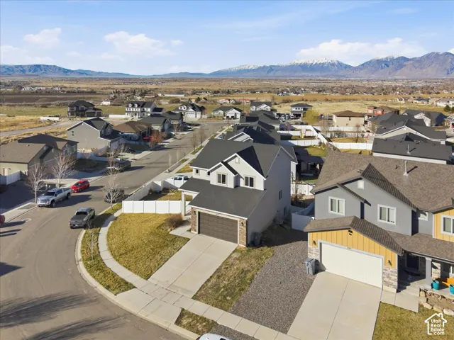 Aerial perspective of suburban area featuring a mountainous background