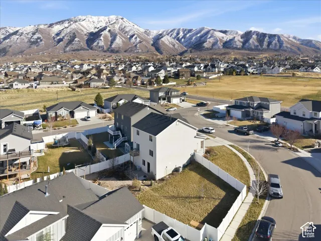 Aerial view of residential area featuring mountains