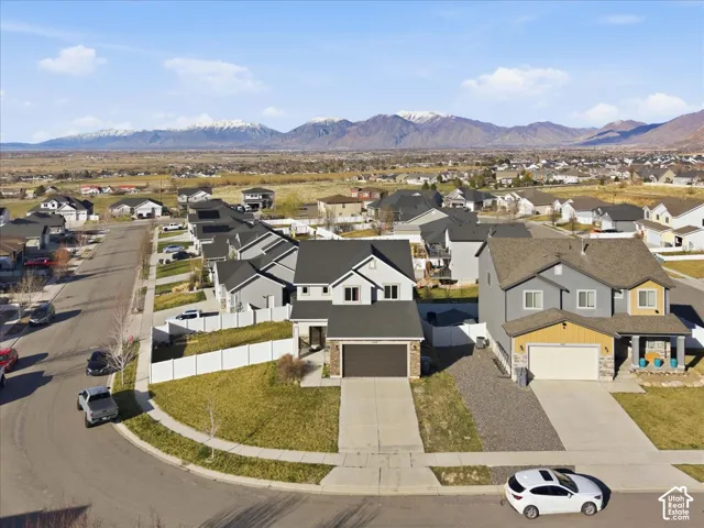 Aerial perspective of suburban area featuring a mountainous background