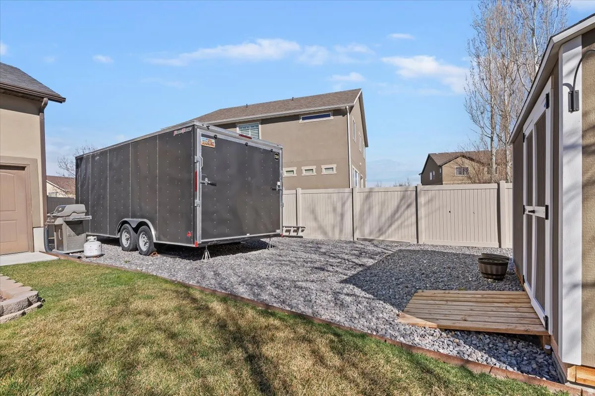 View of shed featuring a fenced backyard