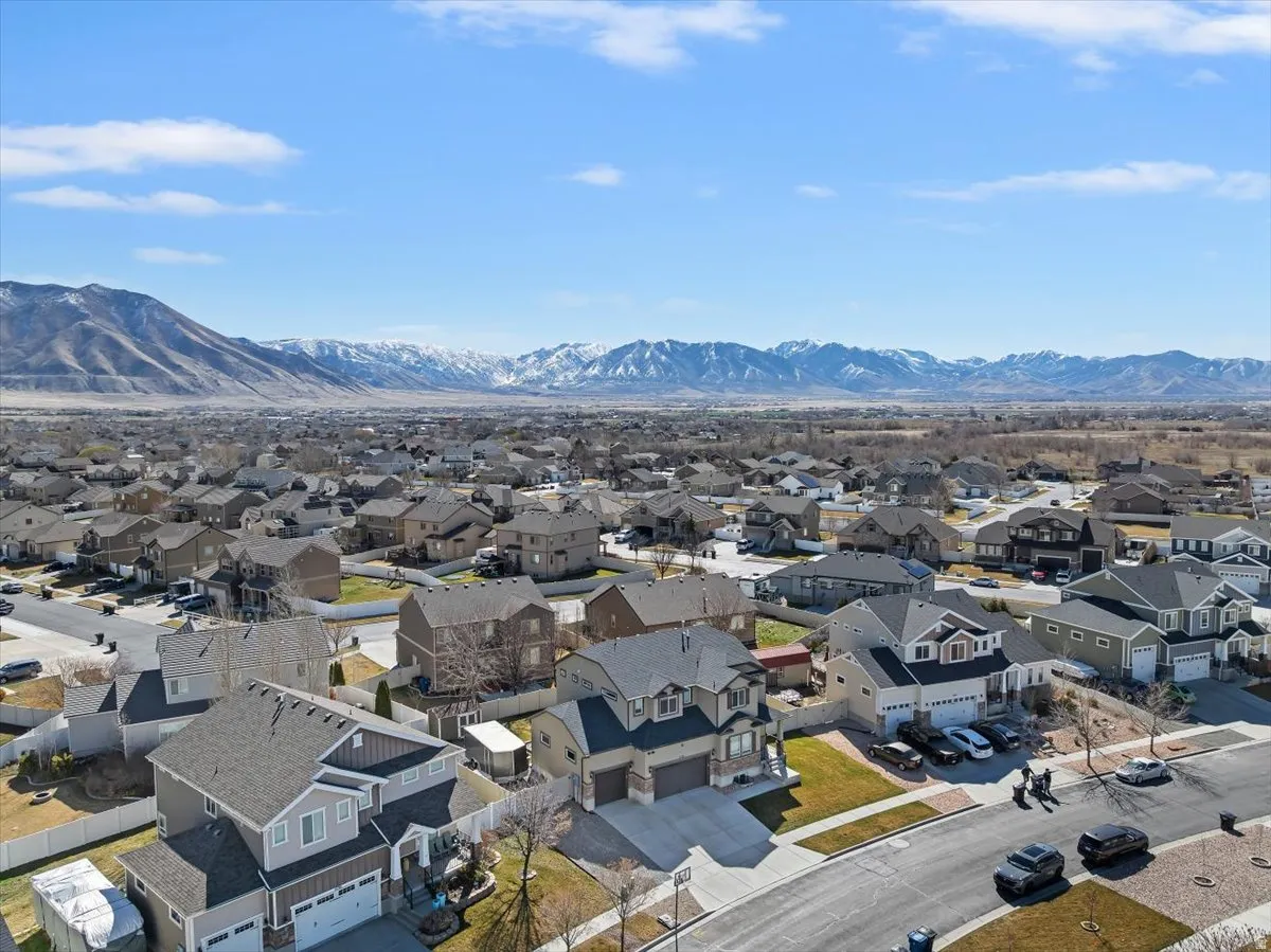 Aerial perspective of suburban area with a mountainous background