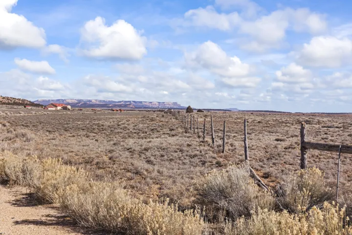 View of yard featuring a rural view and a mountain view