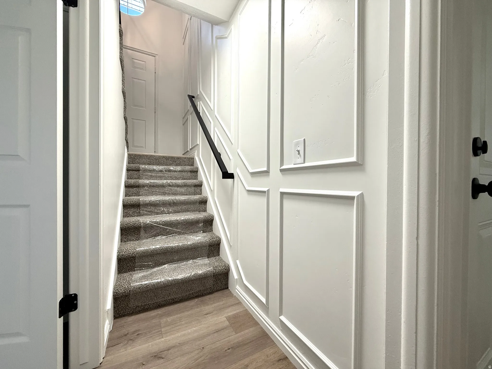 Stairway with wood finished floors