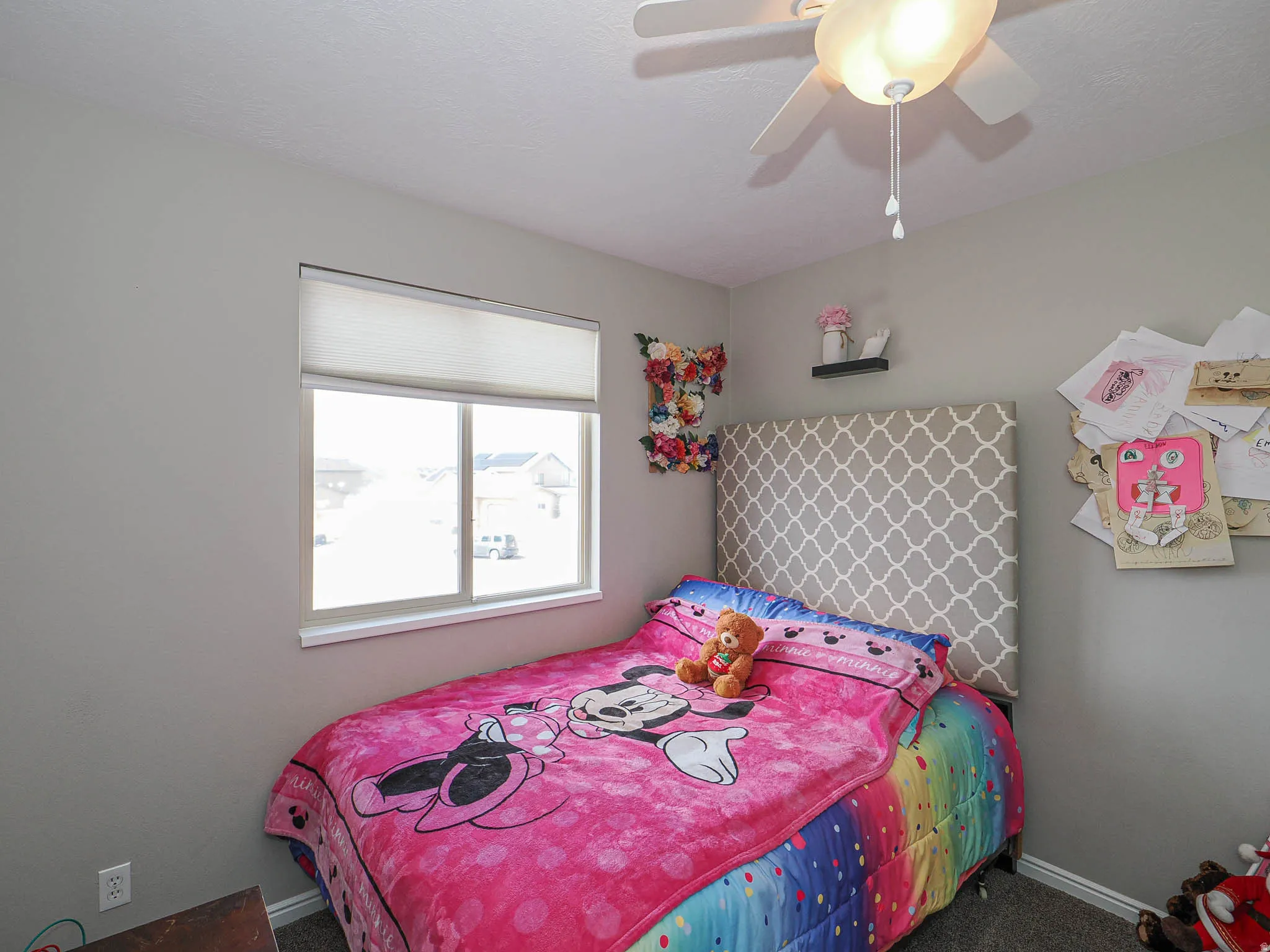 Bedroom with carpet and ceiling fan