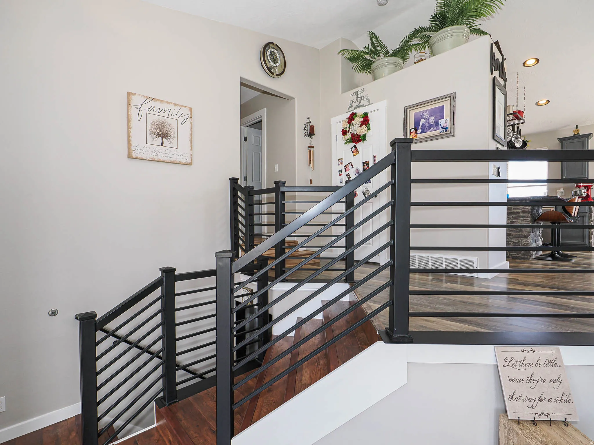 Stairway featuring recessed lighting and wood finished floors