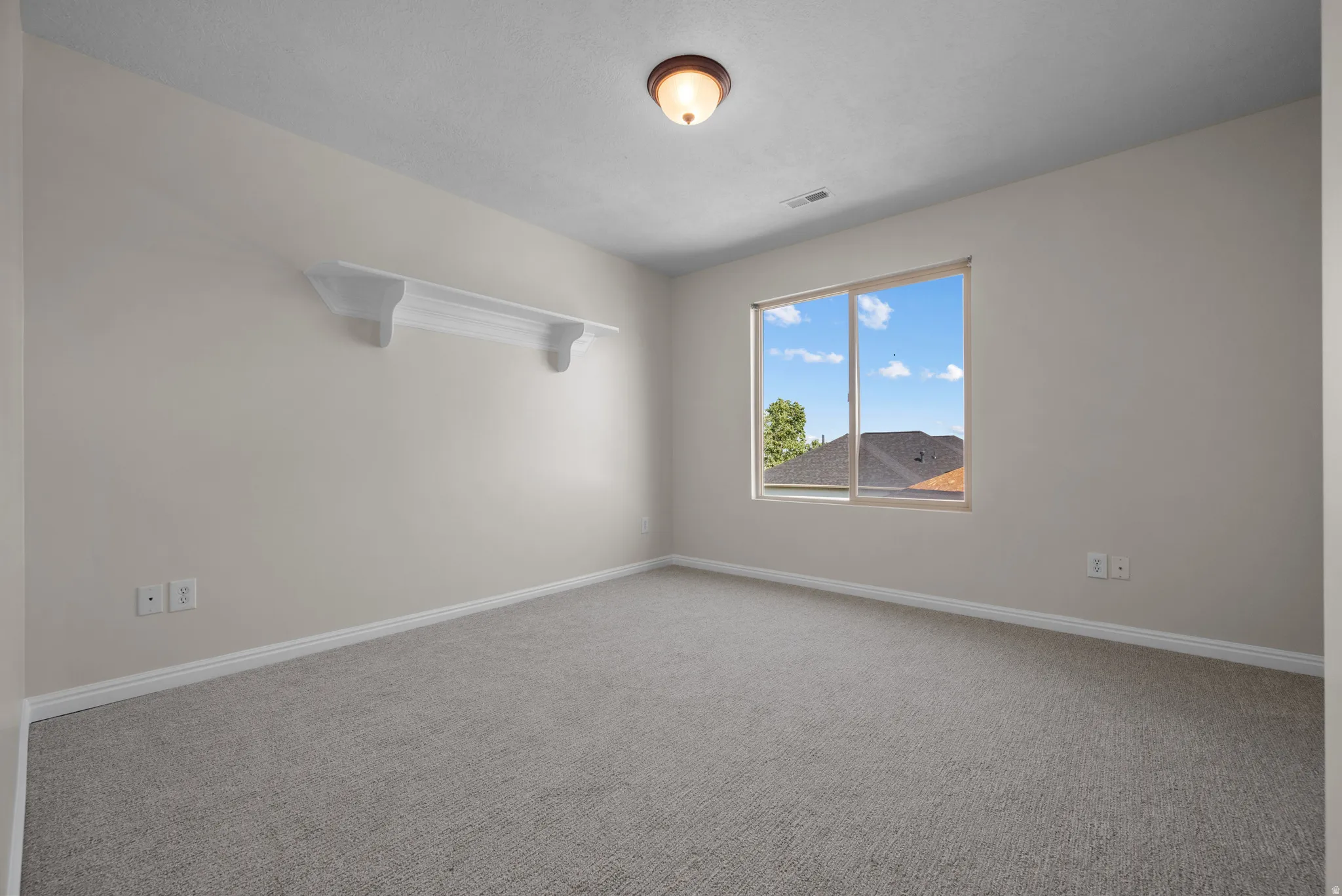 Unfurnished room with carpet and baseboards