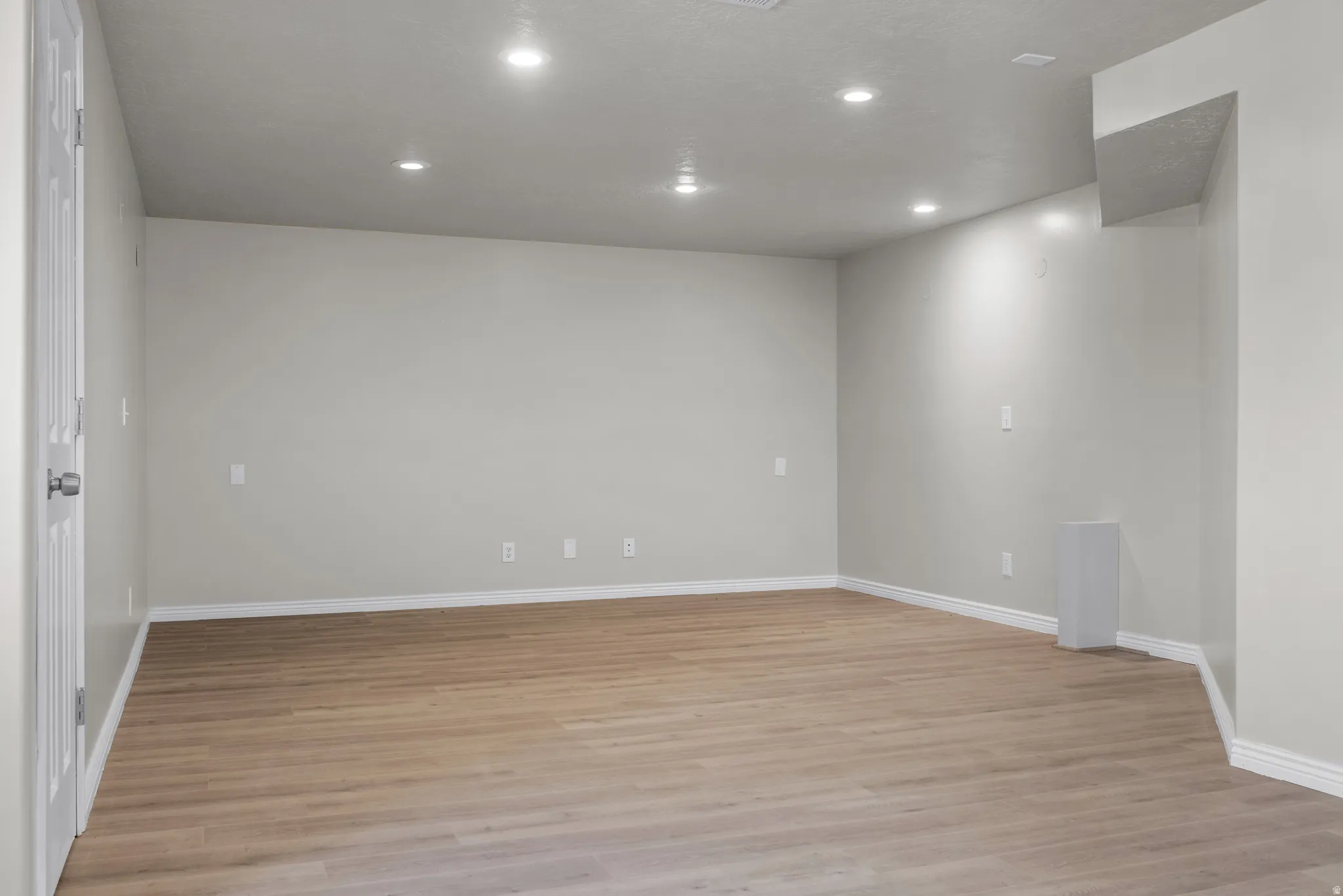 Unfurnished room featuring recessed lighting and light wood finished floors
