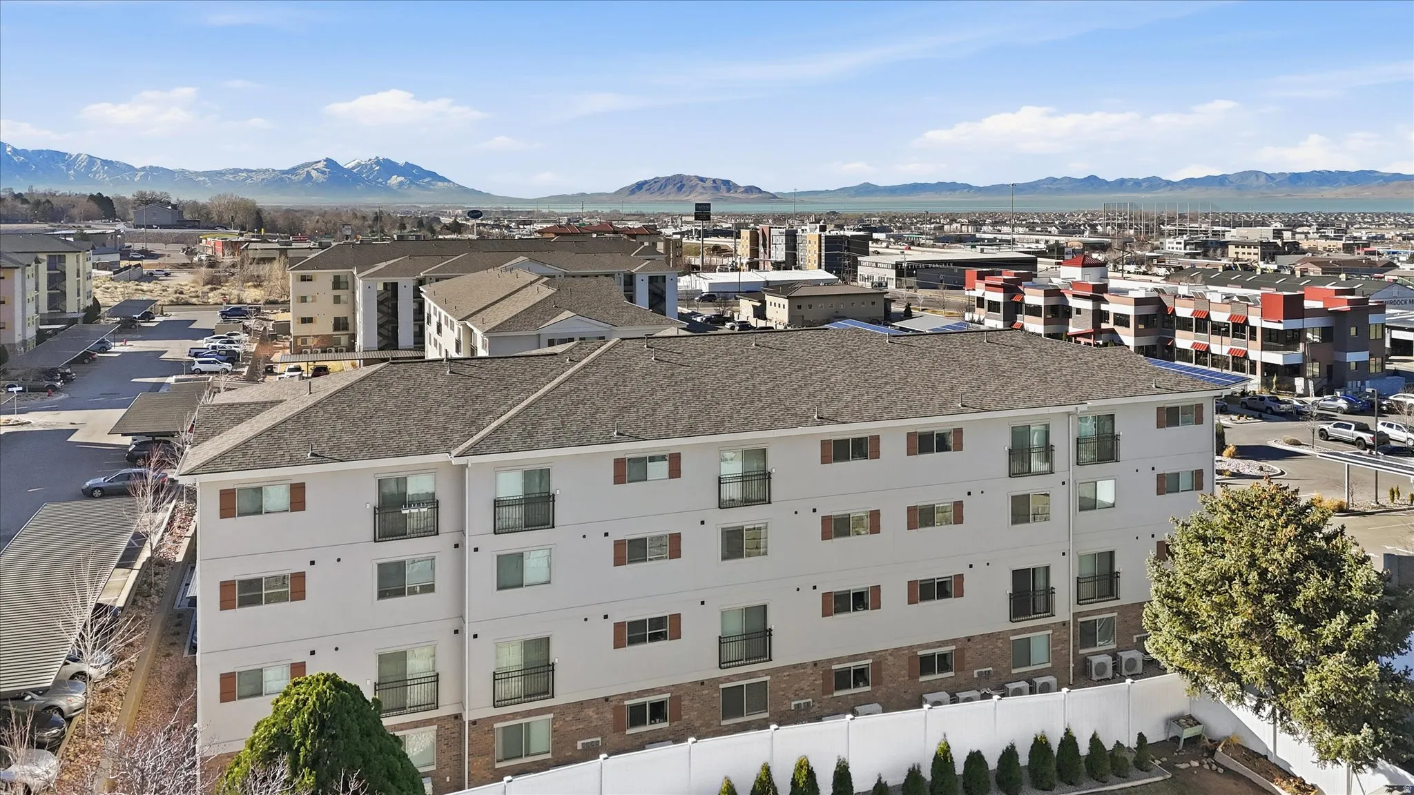 Aerial view of a mountainous background and apartment complex