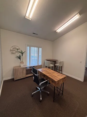 Office featuring a textured ceiling